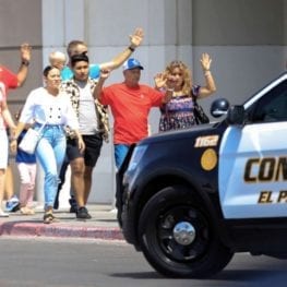 Victims exit a building towards police following the shooting in El Paso, Texas.